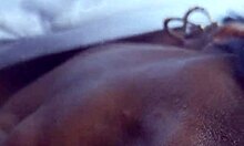 oiled black granny gives monster cock handjob blowjob and cumshot on shaved tits