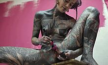 Skinny tattooed babe stretches workwear ass with toys gapes squirts solo