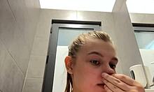 Busty teen sneaks horny pussy squirt in changing room mirror