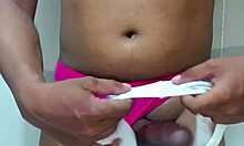 trans crossdresser sniffs erotic panties while stroking cock solo