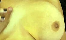 Curvy brunette babe teases with her huge natural assets