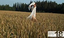 cute redhead teen wanders field fingering wet shaved pussy