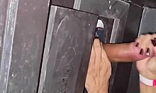 Naughty milf sneaks to gloryhole for cock sucking