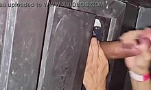 Naughty milf sneaks to gloryhole for cock sucking
