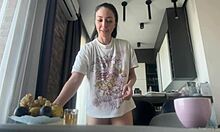 damn this sexy brunette's big shaved ass flashes bare during housework!!