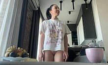 damn this sexy brunette's big shaved ass flashes bare during housework!!