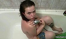 Whoa! Watch plump tattooed Alice shove that dildo deep in her fat ass while showering!