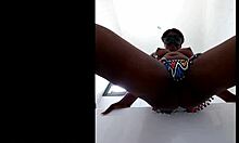 Zulu beauty hides a dildo deep while teasing her full tits and curves