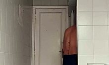 Sexy Guy Shaves Pubes Smooth in Black Beach Shorts Bathroom