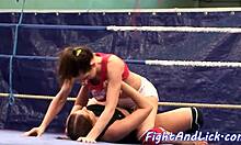 Busty lesbian babes wrestle and lick tits on floor