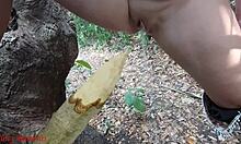 damn this perverted slut squirts piss all over that wooden stake deep in the forest