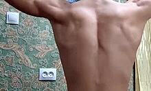 Skinny flexible boy stretches and flexes right after studying.