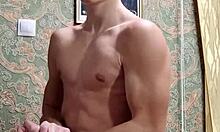 Skinny flexible boy stretches and flexes right after studying.