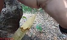damn this perverted slut squirts piss all over that wooden stake deep in the forest