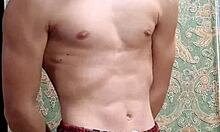 Skinny flexible boy stretches and flexes right after studying.