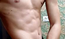 Skinny flexible boy stretches and flexes right after studying.