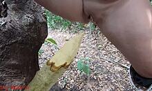 damn this perverted slut squirts piss all over that wooden stake deep in the forest