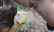 damn this perverted slut squirts piss all over that wooden stake deep in the forest