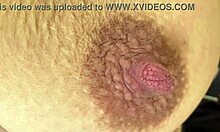 he squeezes stretches my bound dark hard nipples in bondage play