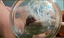 gilf with tan lines jerks huge cock then takes slowmo cumshot in water with friend watching closeup