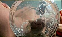 gilf with tan lines jerks huge cock then takes slowmo cumshot in water with friend watching closeup