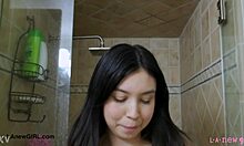 pretty asian teen steps into steamy shower after day