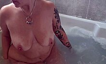 milf babe rubs big tits and shaved pussy in bath