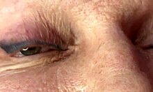 Mature lady moans as huge load blasts across her eyes and face