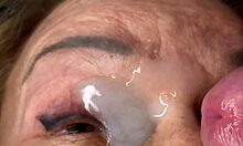 Mature lady moans as huge load blasts across her eyes and face