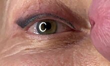 Mature lady moans as huge load blasts across her eyes and face