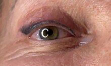 Mature lady moans as huge load blasts across her eyes and face