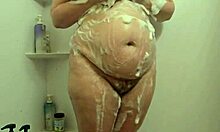 bbw milf soaks shower walls with her juicy curves hidden cam catches every wet drop