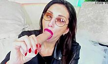 sexy glasses milf sucks dildo deep while teasing her big tits