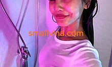 busty asian brunette teen strips in bathroom showing big ass curves?