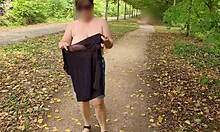 a busty mature milf cougar flashes huge natural saggy tits public outdoor