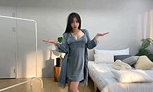 korean babe swaps clothes and teases in her cozy room