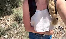 cute college blonde strips naked in jungle showing off her juicy curves