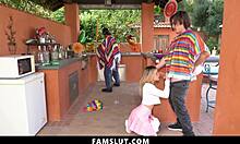 The petite stepsister sneaks a blowjob on her stepbrother's cock while stepdad's unaware