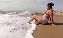 latina with huge ass gets so turned on by beach sun she fingers herself wildly in the sand