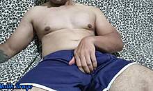 dude in shorts can't help it his huge cock throbs so he strokes it hard till he explodes everywhere