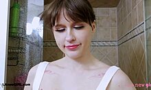 Fresh-faced blonde boldly strips in shower