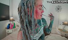 damn this tattooed babe strips and rams huge dildo in her tight holes