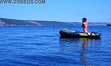mature couple relaxes on boat in volga river water wearing bikinis