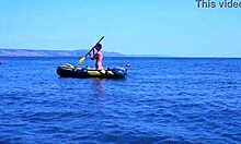 mature couple relaxes on boat in volga river water wearing bikinis