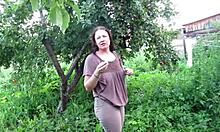 wet milf soaks jeans with hot piss in public garden outdoors