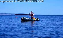 mature couple relaxes on boat in volga river water wearing bikinis