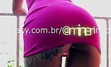 hey check this busty brunette milf with huge ass fucking wildly on the balcony... damn!