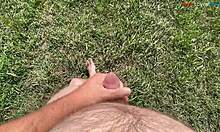 barefoot cutie teases feet while stroking cock outdoors this fall