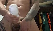 Tattooed girl stands for slow-motion cumshot exposing pierced nipples
