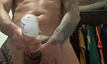 Tattooed girl stands for slow-motion cumshot exposing pierced nipples